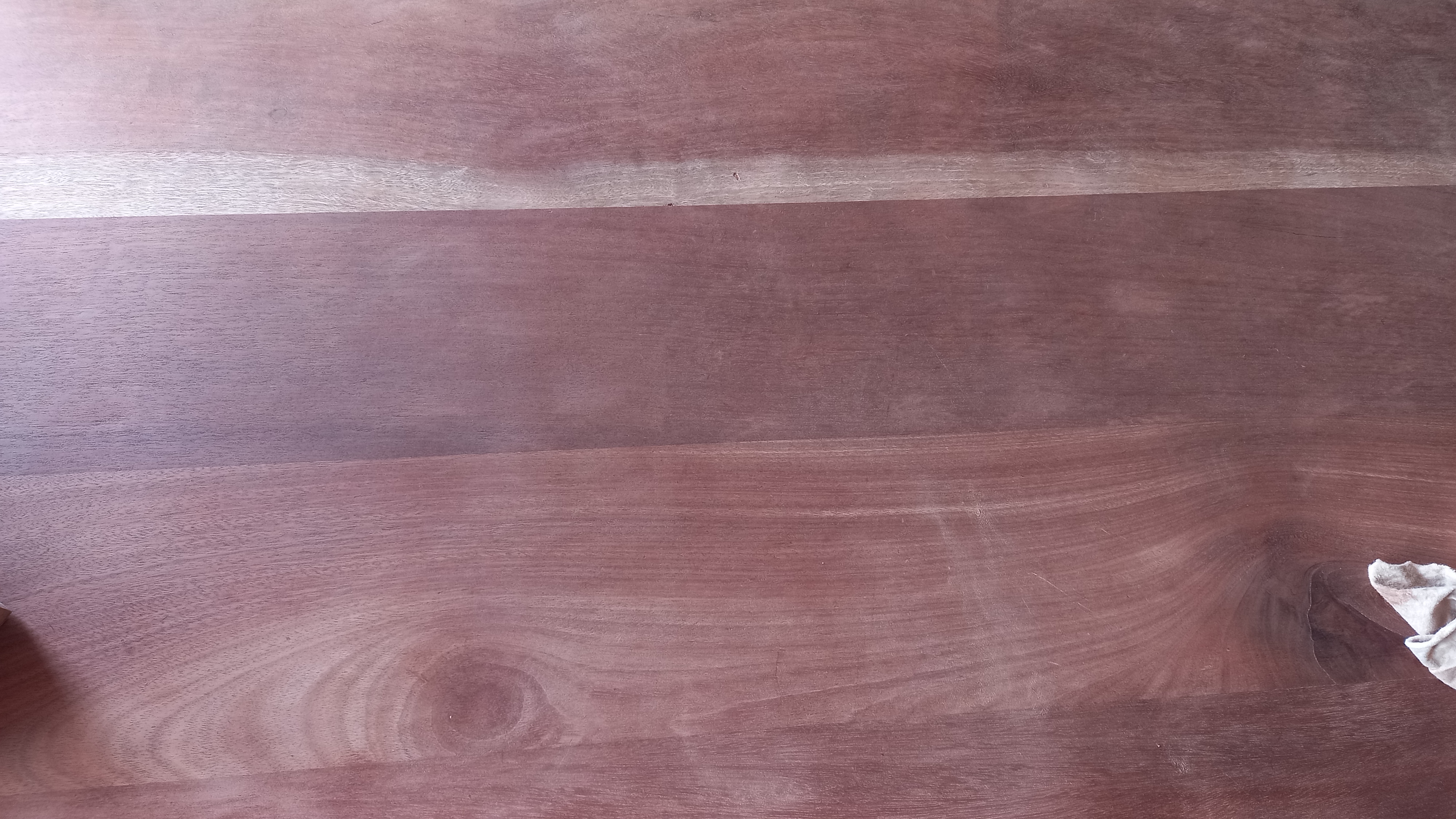 Close-up of deteriorated pinkish finish