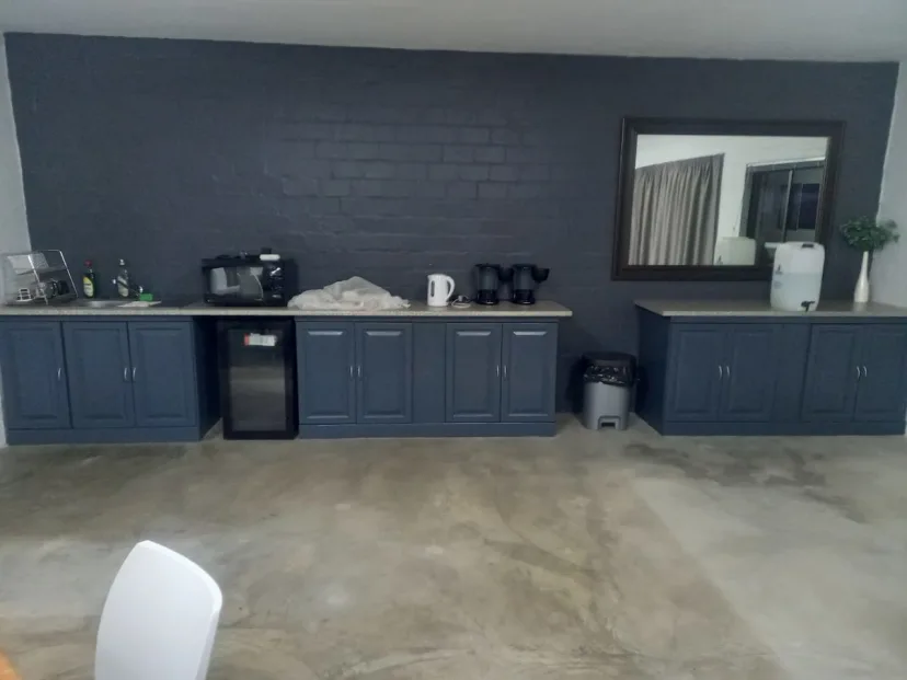 Completed church kitchen with sleek charcoal-gray cabinets