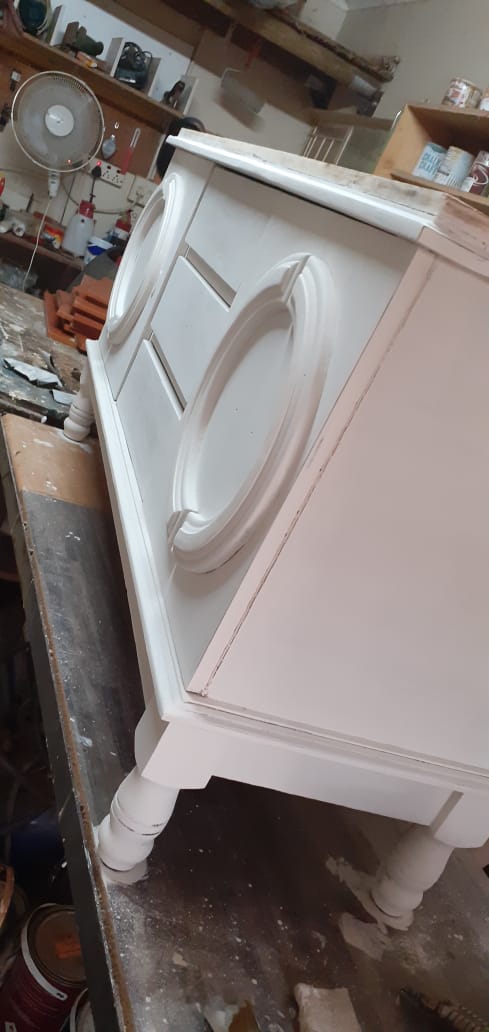 Side view showcasing pristine white finish and black hardware