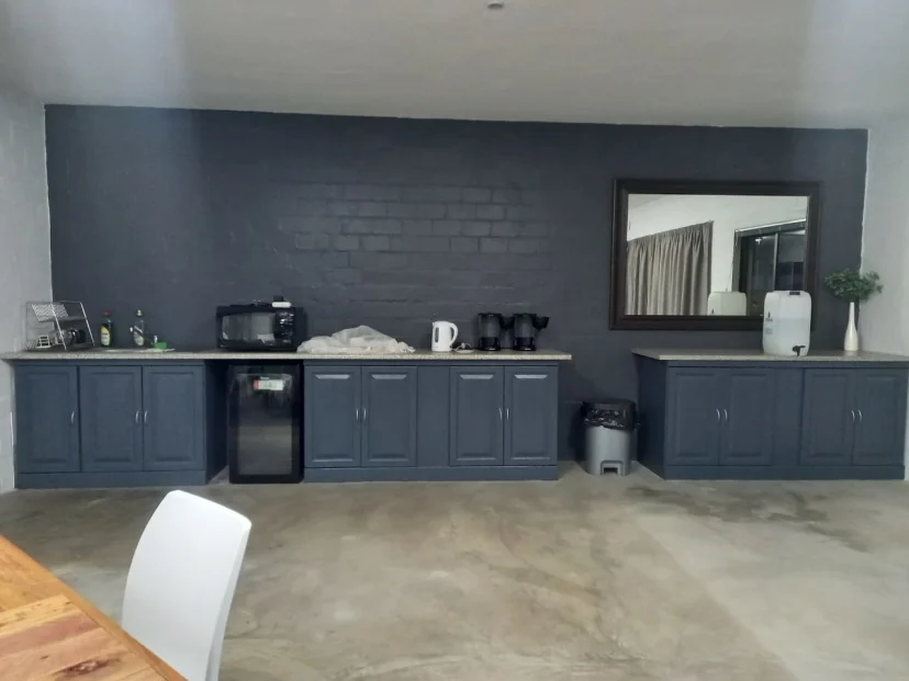 Finished kitchen showing industrial-style gray cabinetry