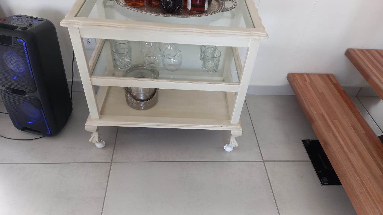 Completed whitewashed bar cart styled in home with decorative accessories